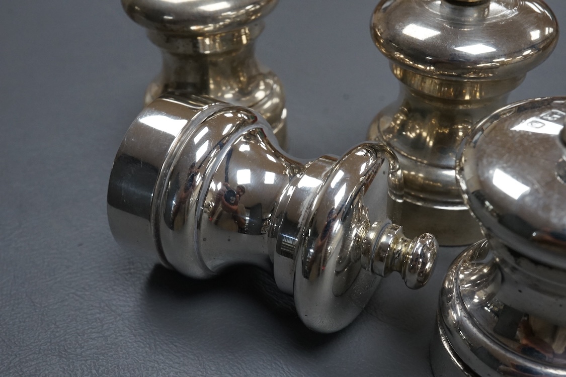 Four modern silver mounted salt and pepper mills, M C Hersey & Son Ltd, London, 1990/91/92, height 70mm.